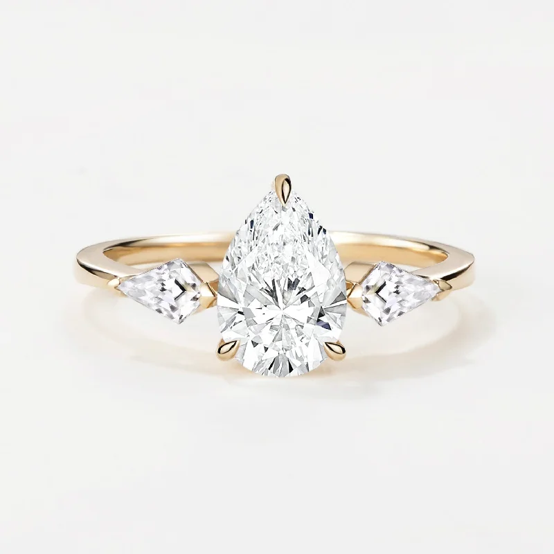 Halo - Style Women's Diamond Rings with a Center Diamond Surrounded by Smaller Diamonds in 18K Gold1.0ct Pear Shaped Colorless Lab Grown Diamond Three Stone Gold Ring Halo - Style Women's Diamond Rings with a Center Diamond Surrounded by Smaller Diamonds in 18K Gold1.0ct Pear Shaped Colorless Lab Grown Diamond Three Stone Gold Ring
