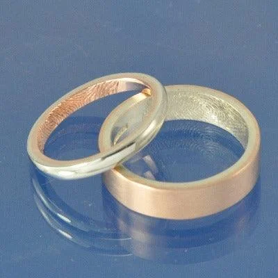 Interlocking double finger rings with a symbolic meaningFingerprint Wedding Rings - 9k Gold Two Tone Interlocking double finger rings with a symbolic meaningFingerprint Wedding Rings - 9k Gold Two Tone