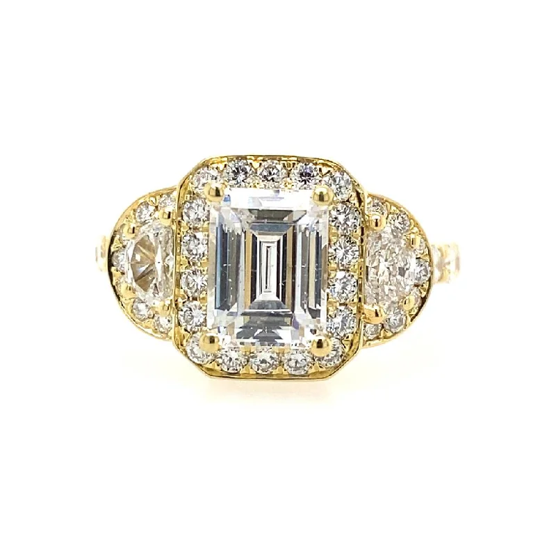 Cathedral - Style Women's Diamond Rings with a Raised Center Setting and Elaborate Metalwork18K Yellow Gold Three Stone Halo Emerald Cut Diamond Engagement Ring Cathedral - Style Women's Diamond Rings with a Raised Center Setting and Elaborate Metalwork18K Yellow Gold Three Stone Halo Emerald Cut Diamond Engagement Ring