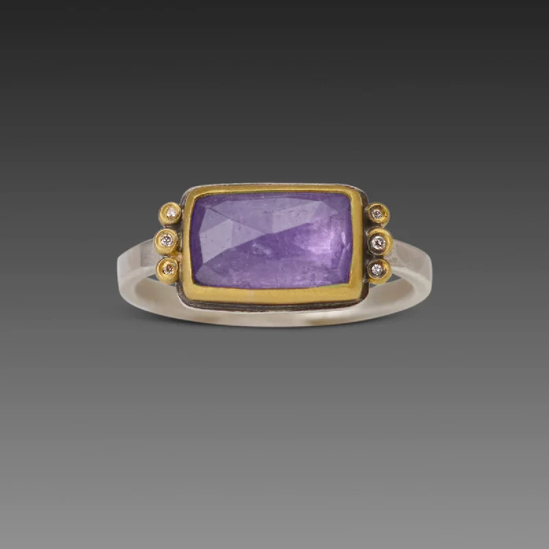 Iolite Gemstone Rings in 10K Gold with a Twisted Band for a Distinctive and Stylish AccessoryRectangular Tanzanite Ring with Diamond Trios Iolite Gemstone Rings in 10K Gold with a Twisted Band for a Distinctive and Stylish AccessoryRectangular Tanzanite Ring with Diamond Trios
