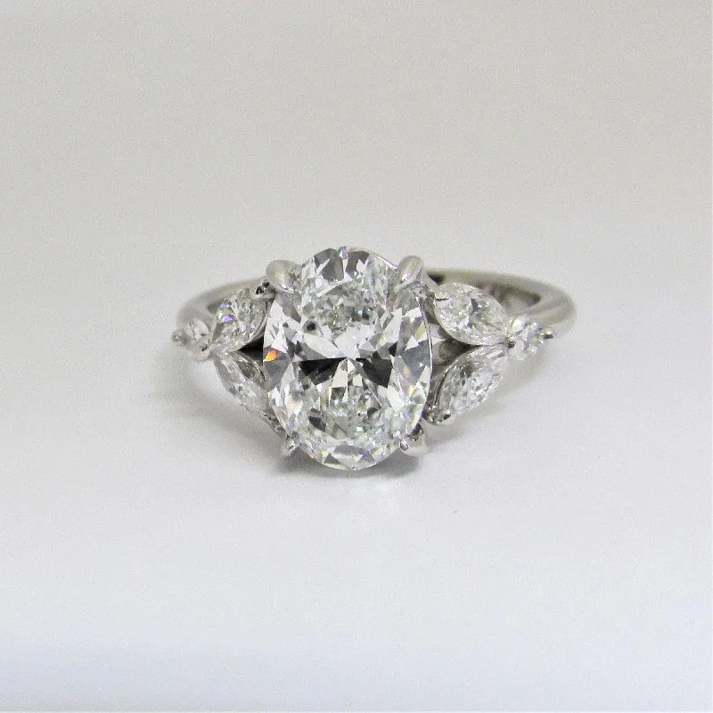 Commemorate rings with a diamond - and - opal combinationOval Diamond and Marquise petals Engagement Ring Commemorate rings with a diamond - and - opal combinationOval Diamond and Marquise petals Engagement Ring
